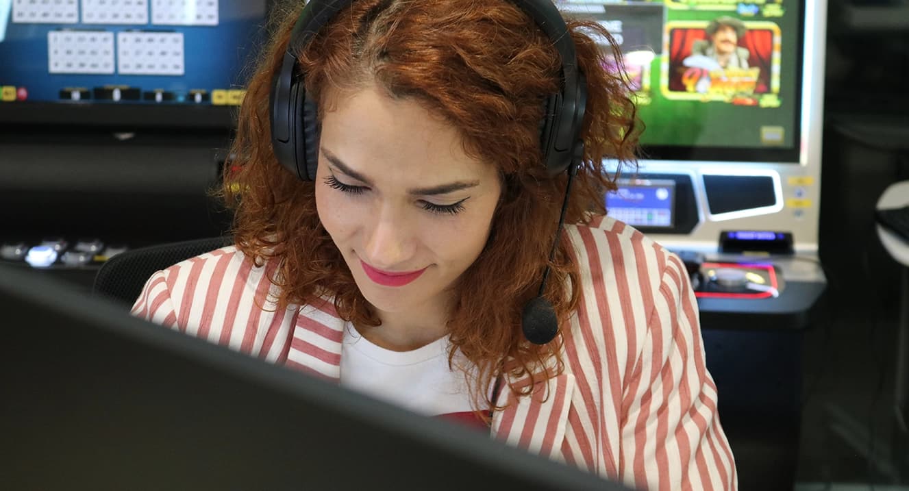 woman in technology world smiling at the office